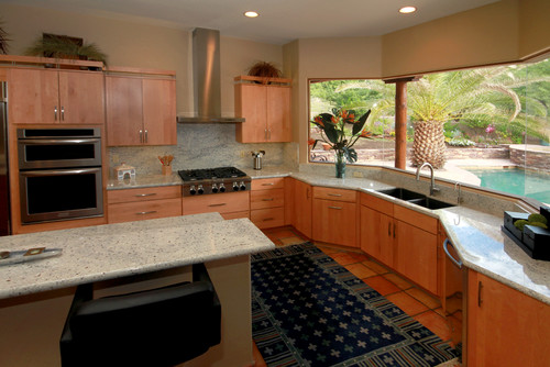 Bianco Romano Granite Countertop, Bianco Romano Full High Backsplash, Bianco Romano Raised Breakfast Bar , Ameretto with Burnt Umber Glazed Maple Cabinets, Stainless Steel Appliance and Saltillo Flooring Tiles